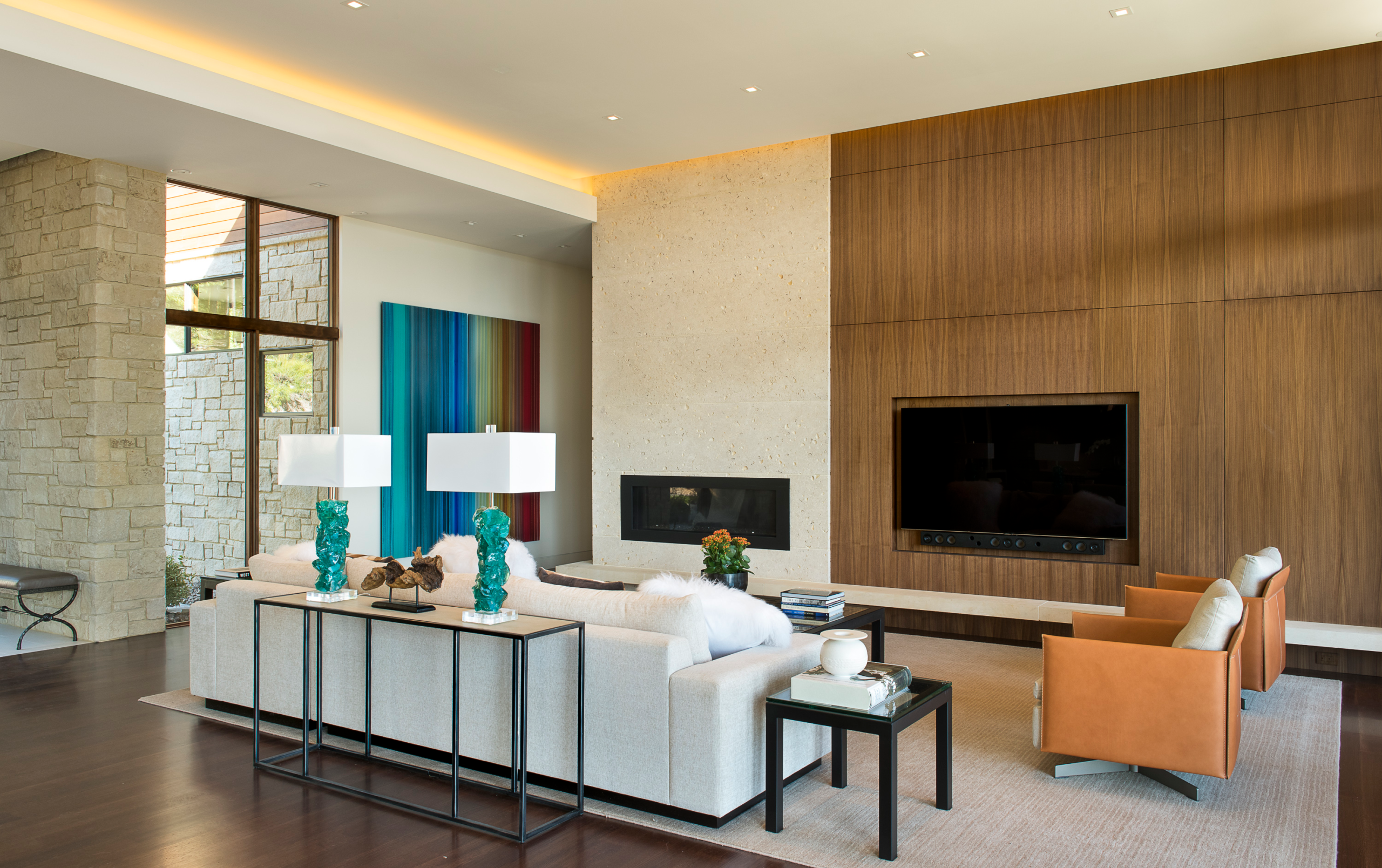 Vaulted great room with hand-hewn Douglas fir beams and double-sided dry stack fireplace