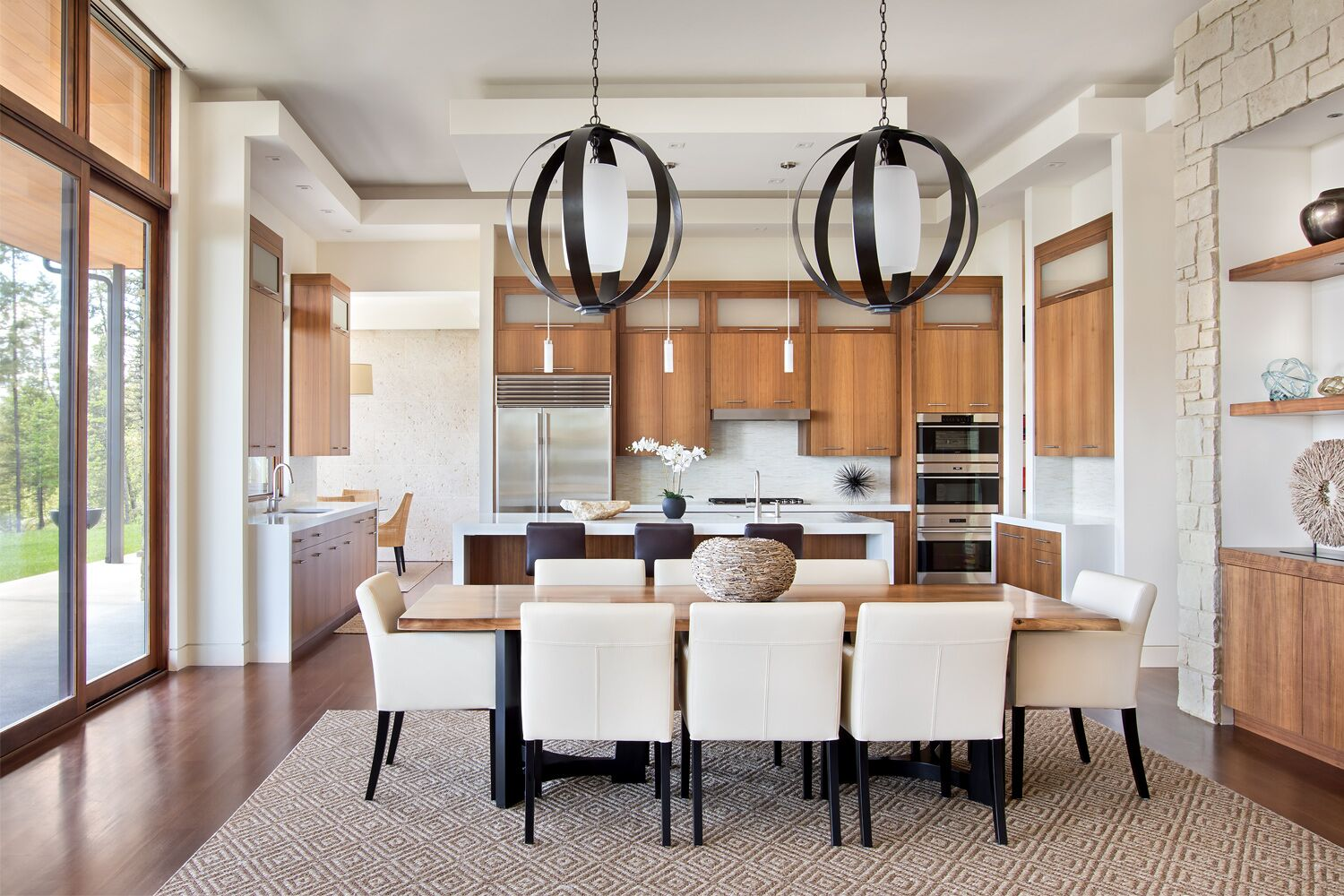 Two-story private library with walnut millwork and rolling brass ladder